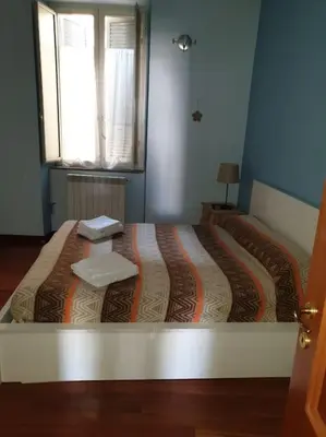 Letto o letti in una camera di CASA MARGHERITA