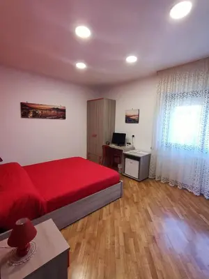 Letto o letti in una camera di Rosso di sera