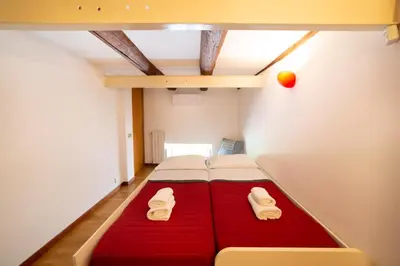 Letto o letti in una camera di The Port'Alba Apartment By HouseinNaples