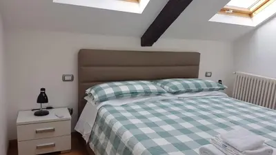 Letto o letti in una camera di Napolidays Mansarda Nicola Amore