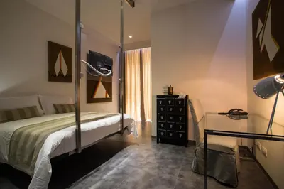 Letto o letti in una camera di Hotel Santa Brigida