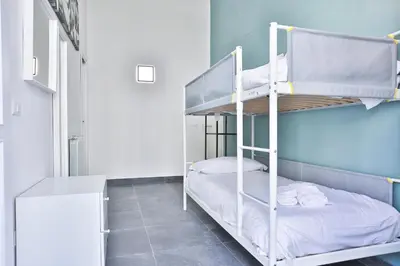 Letto o letti in una camera di GuestHost - La finestra su Garibaldi