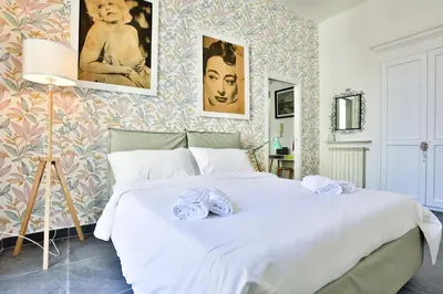 Letto o letti in una camera di GuestHost - La finestra su Garibaldi