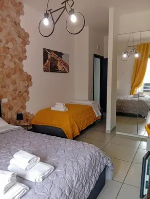 Letto o letti in una camera di Megaride Santa Lucia