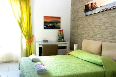 Letto o letti in una camera di Megaride Santa Lucia