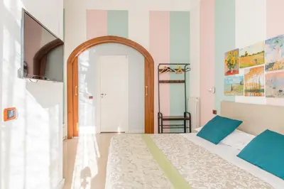 Letto o letti in una camera di Residence Appartamenti Santa Teresa a Chiaia