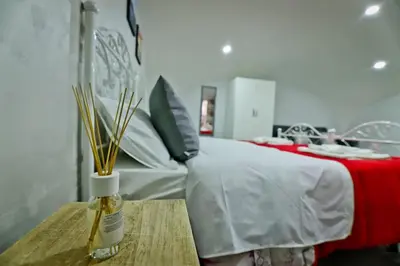 Letto o letti in una camera di A'CASA E' MAMMA'