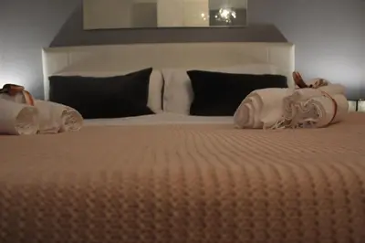 Letto o letti in una camera di Suite De Gasperi