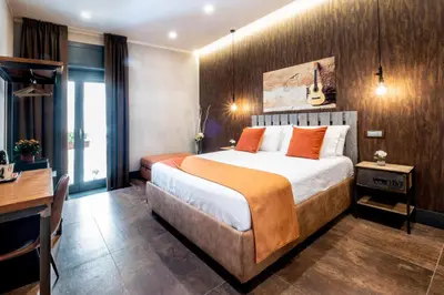 Letto o letti in una camera di casajammone naples b&b