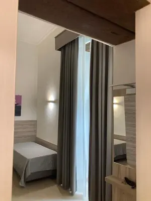 Letto o letti in una camera di 4STANZE