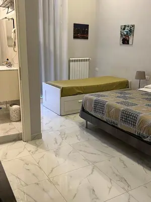 Letto o letti in una camera di San Gennaro in porta
