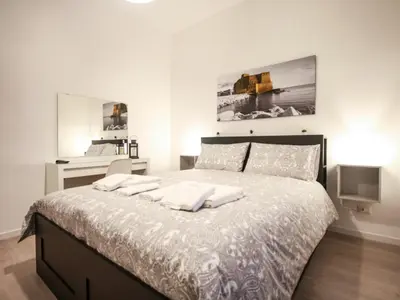 Letto o letti in una camera di ChilometroZERO luxury apartment