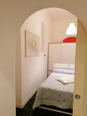 Letto o letti in una camera di Casa Scialò Cuore di Napoli