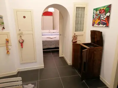Letto o letti in una camera di Casa Scialò Cuore di Napoli
