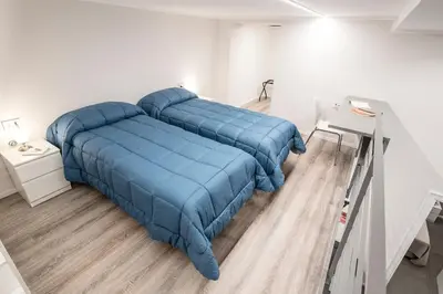 Letto o letti in una camera di Three Houses Toledo