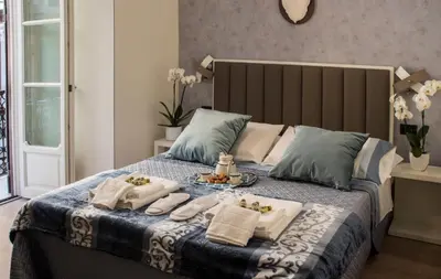 Letto o letti in una camera di Napoli Mariana Luxury