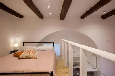 Letto o letti in una camera di Il Palchetto Centralissimo Napoli Old Town