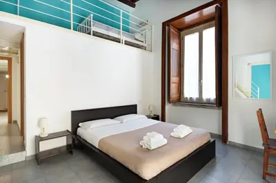 Letto o letti in una camera di Napoli Napoli Rooms