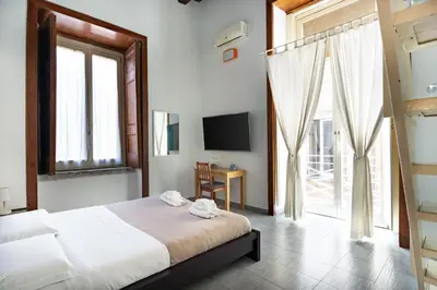 Letto o letti in una camera di Napoli Napoli Rooms
