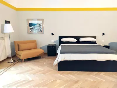 Letto o letti in una camera di NAPOLIXSUITE