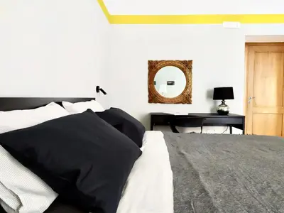 Letto o letti in una camera di NAPOLIXSUITE