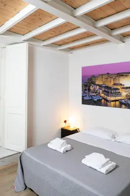 Letto o letti in una camera di Monaciello