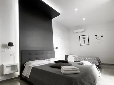 Letto o letti in una camera di Aurora Luxury Rooms