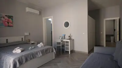 Letto o letti in una camera di Soggiorno Napoletano