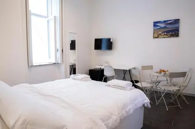 Letto o letti in una camera di AllYouCanTrip - La Nova