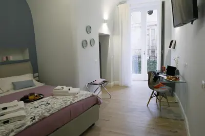 Letto o letti in una camera di Porta San Gennaro