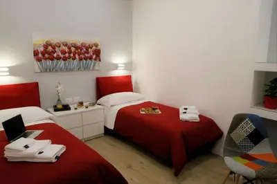 Letto o letti in una camera di Porta San Gennaro