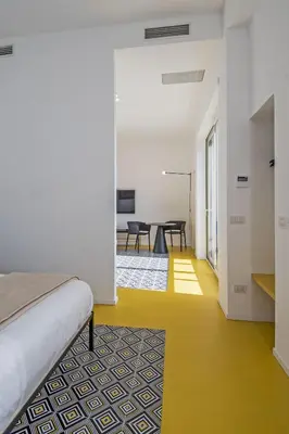 Letto o letti in una camera di Toraldo Suites - Dimore Partenopee