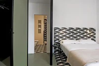 Letto o letti in una camera di Toraldo Suites - Dimore Partenopee