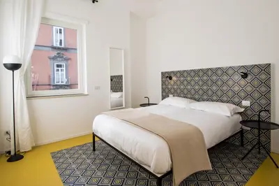 Letto o letti in una camera di Toraldo Suites - Dimore Partenopee