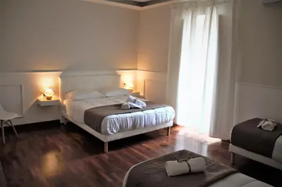 Letto o letti in una camera di MAMO al Museo