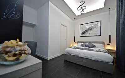 Letto o letti in una camera di Suite Quarantotto