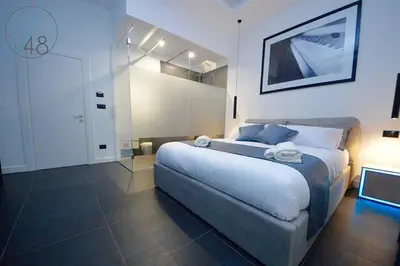 Letto o letti in una camera di Suite Quarantotto