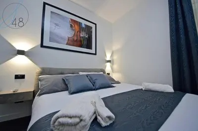 Letto o letti in una camera di Suite Quarantotto
