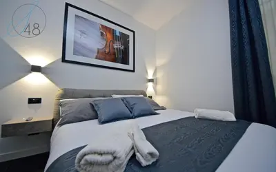 Letto o letti in una camera di Suite Quarantotto