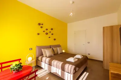 Letto o letti in una camera di NEAPOLITAN SKYSCRAPER APARTMENT
