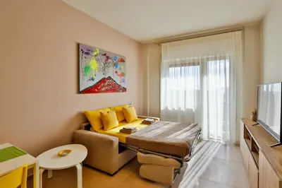TV o dispositivi per l'intrattenimento presso NEAPOLITAN SKYSCRAPER APARTMENT