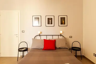 Letto o letti in una camera di NEAPOLITAN SKYSCRAPER APARTMENT