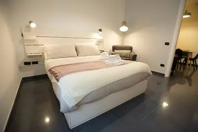 Letto o letti in una camera di Il giardinetto a Colori by Dimorra