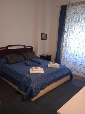Letto o letti in una camera di WELL COME - Piazza Plebiscito