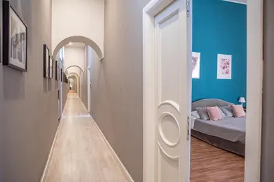 Letto o letti in una camera di B&B Ruffo di Bagnara Palazzo Monumentale