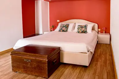 Letto o letti in una camera di B&B Ruffo di Bagnara Palazzo Monumentale