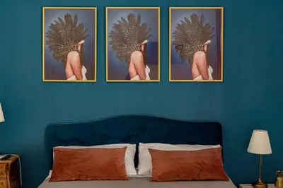 Letto o letti in una camera di B&B Ruffo di Bagnara Palazzo Monumentale
