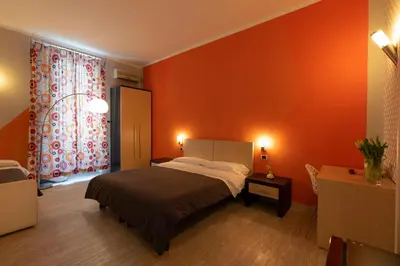 Letto o letti in una camera di H Rooms boutique Hotel
