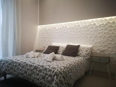 Letto o letti in una camera di SpiderRooms