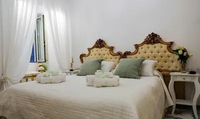 Letto o letti in una camera di Giallo Napoletano Home